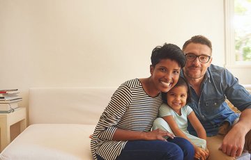 smiling family with baby