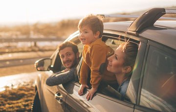 family takes new car to beach