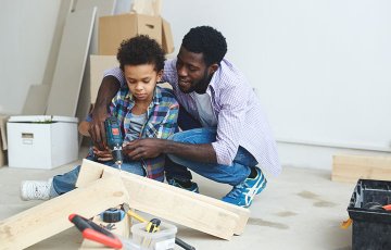 father and son working on a home improvement project