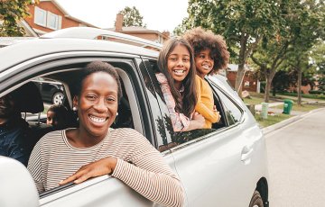 happy family in new Subaru