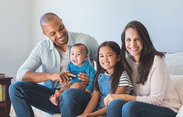 happy family on couch with children