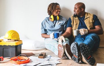 Couple taking a break from home improvement project