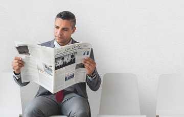 man reading newspaper